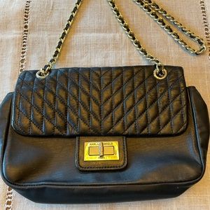 Women Handling Karl Lagerfeld (Paris) Black Color Gold Chain in Excellent shapes